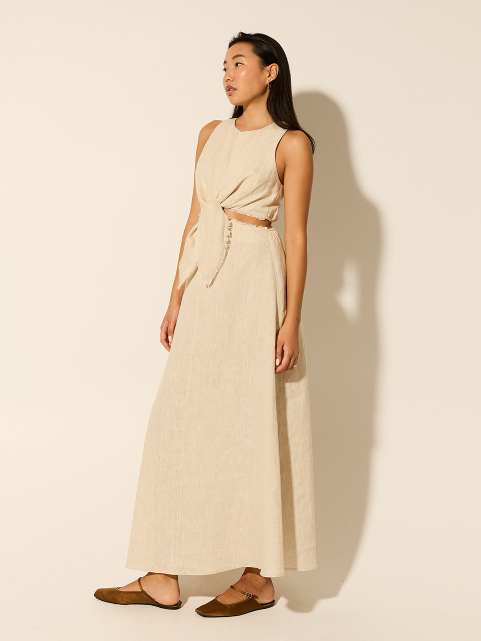 Ellie Cut Out Maxi Dress KIVARI | Model wears neutral linen maxi dress side view