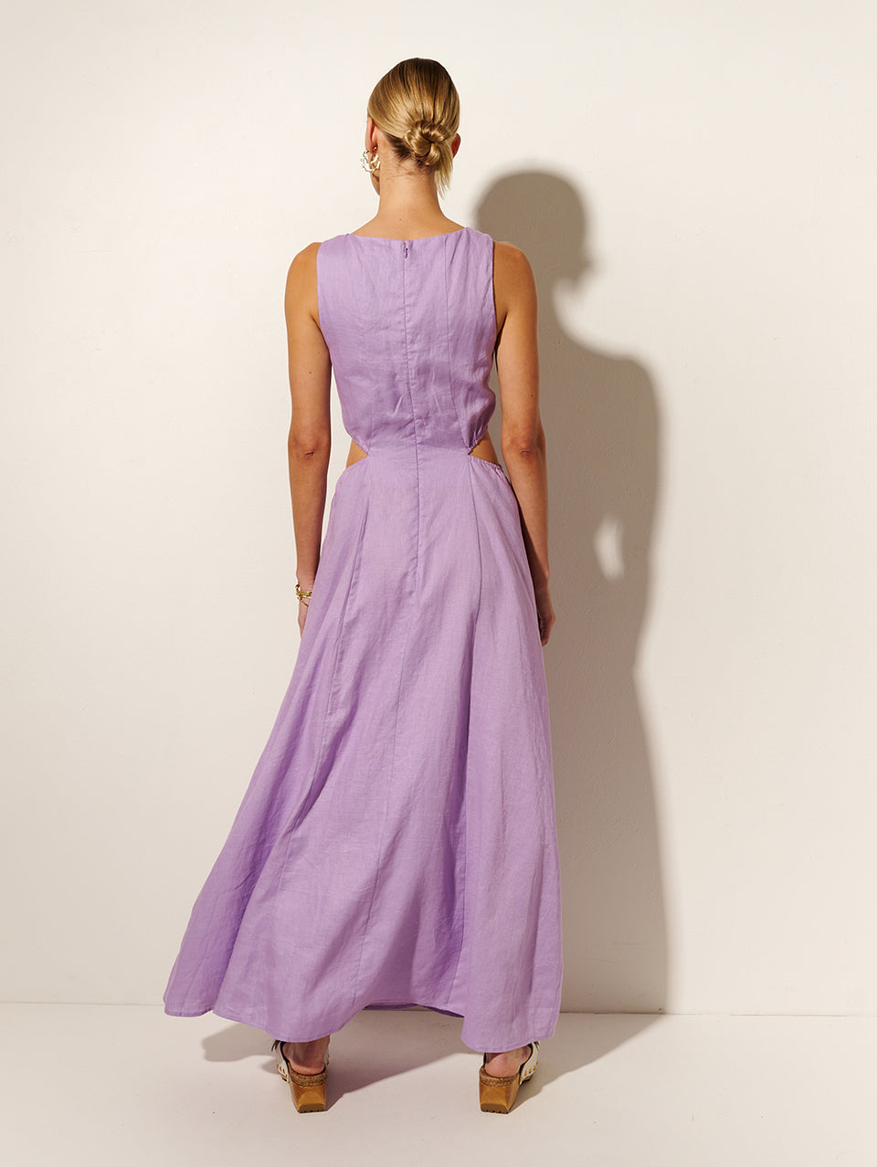 Ellie Cut Out Maxi Dress KIVARI | Model wears purple cut out maxi dress back view