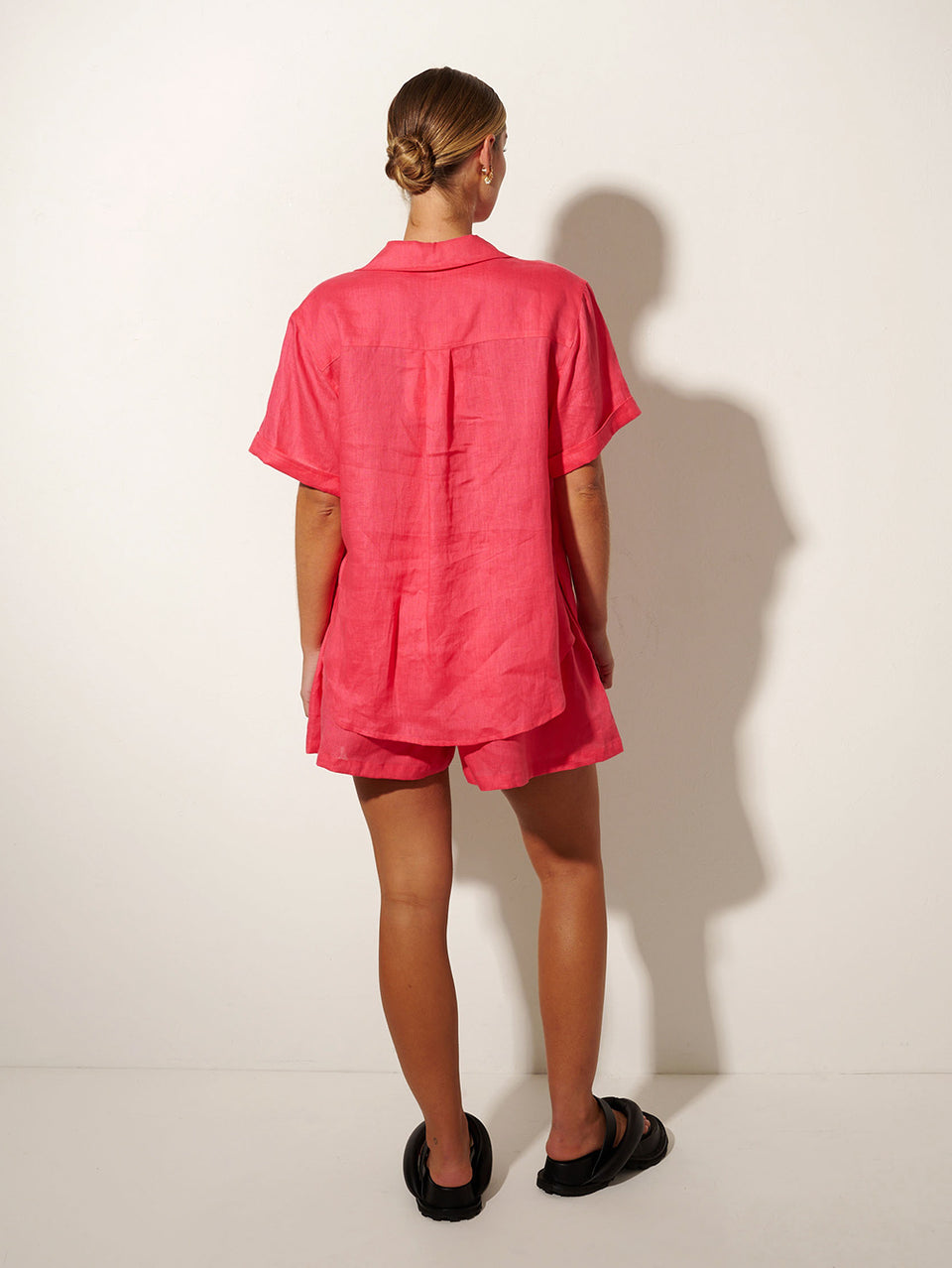 KIVARI Jacana Short | Model wears Pink Shorts Back View