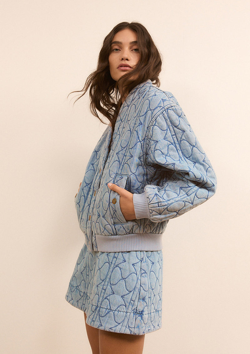 KIVARI quilted denim jacket and mini skirt set in blue - woman wearing matching denim co-ord, feature mobile banner