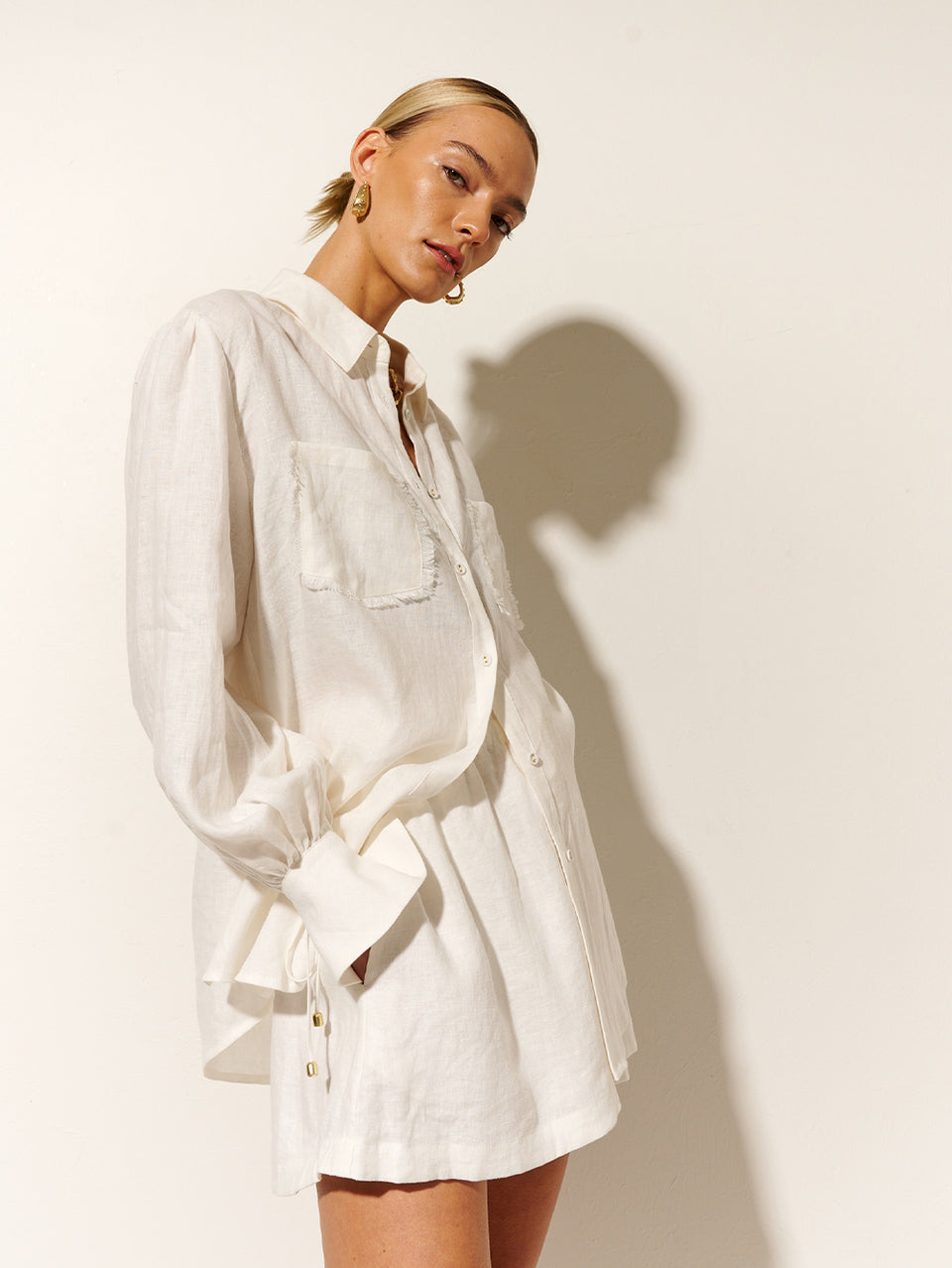 Franca Shirt KIVARI | Model wears white linen shirt side view