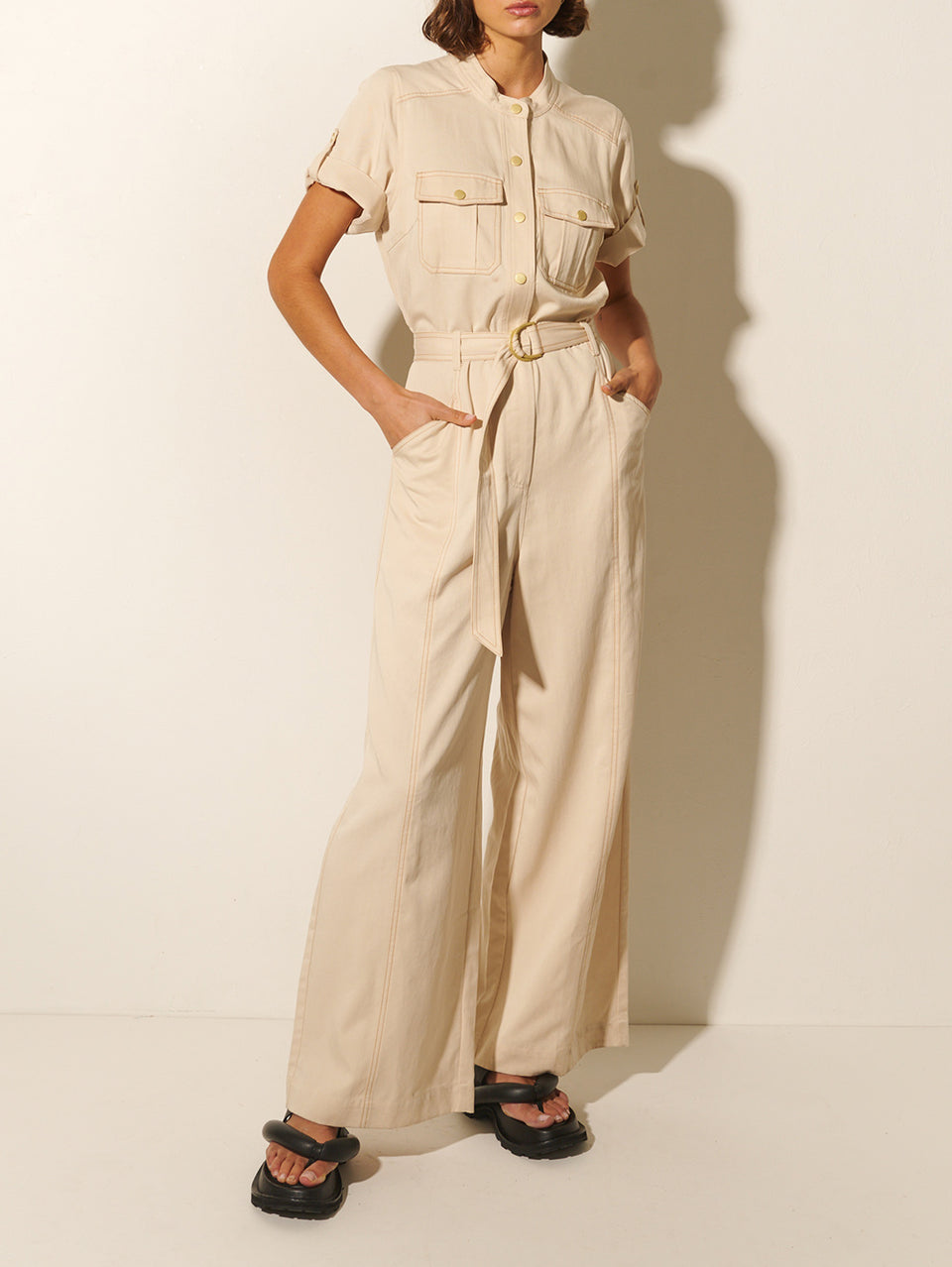 Gianna Jumpsuit KIVARI | Model wears cream short sleeve jumpsuit