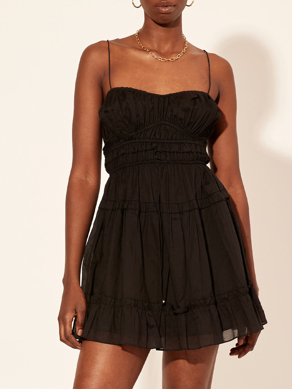 Hallie Mini Dress Black KIVARI | Model wears black mini dress close up