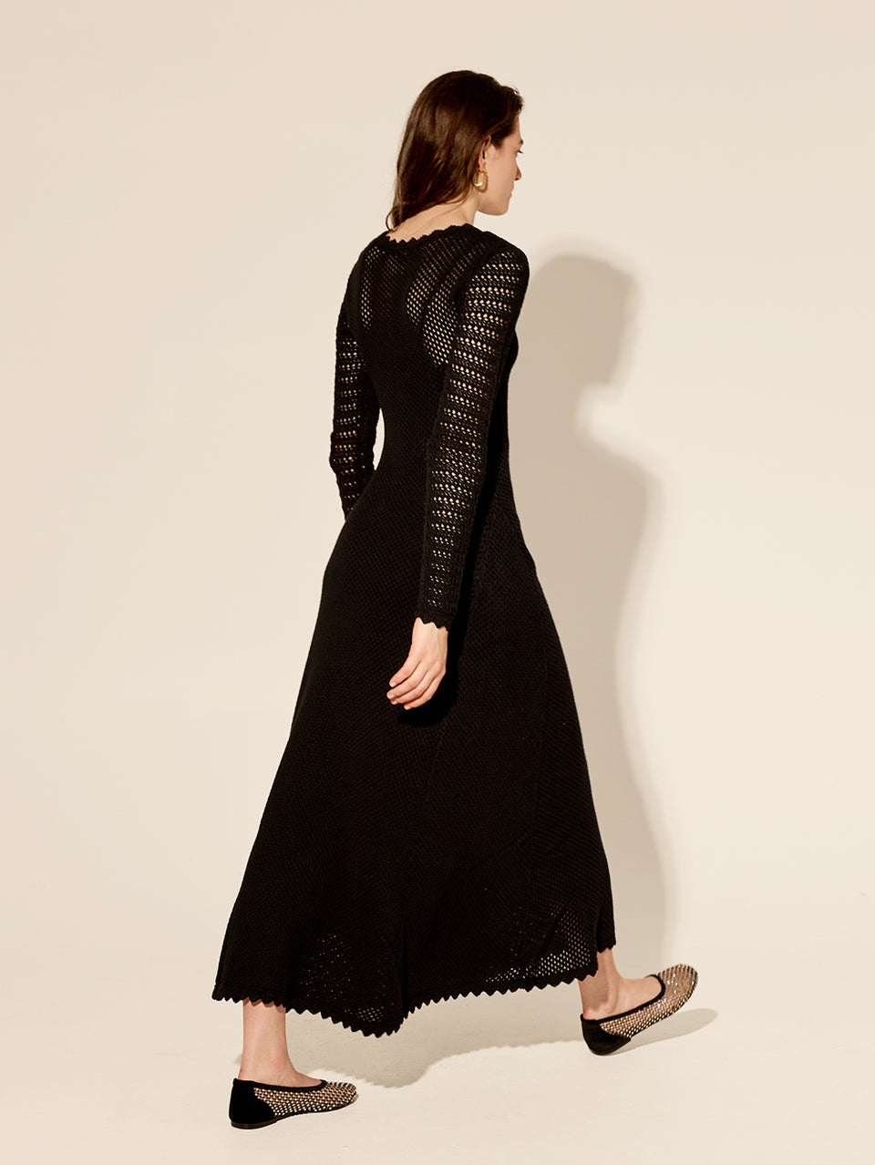 Ingrid Midi Dress Black KIVARI | Model wears black knit midi dress back view