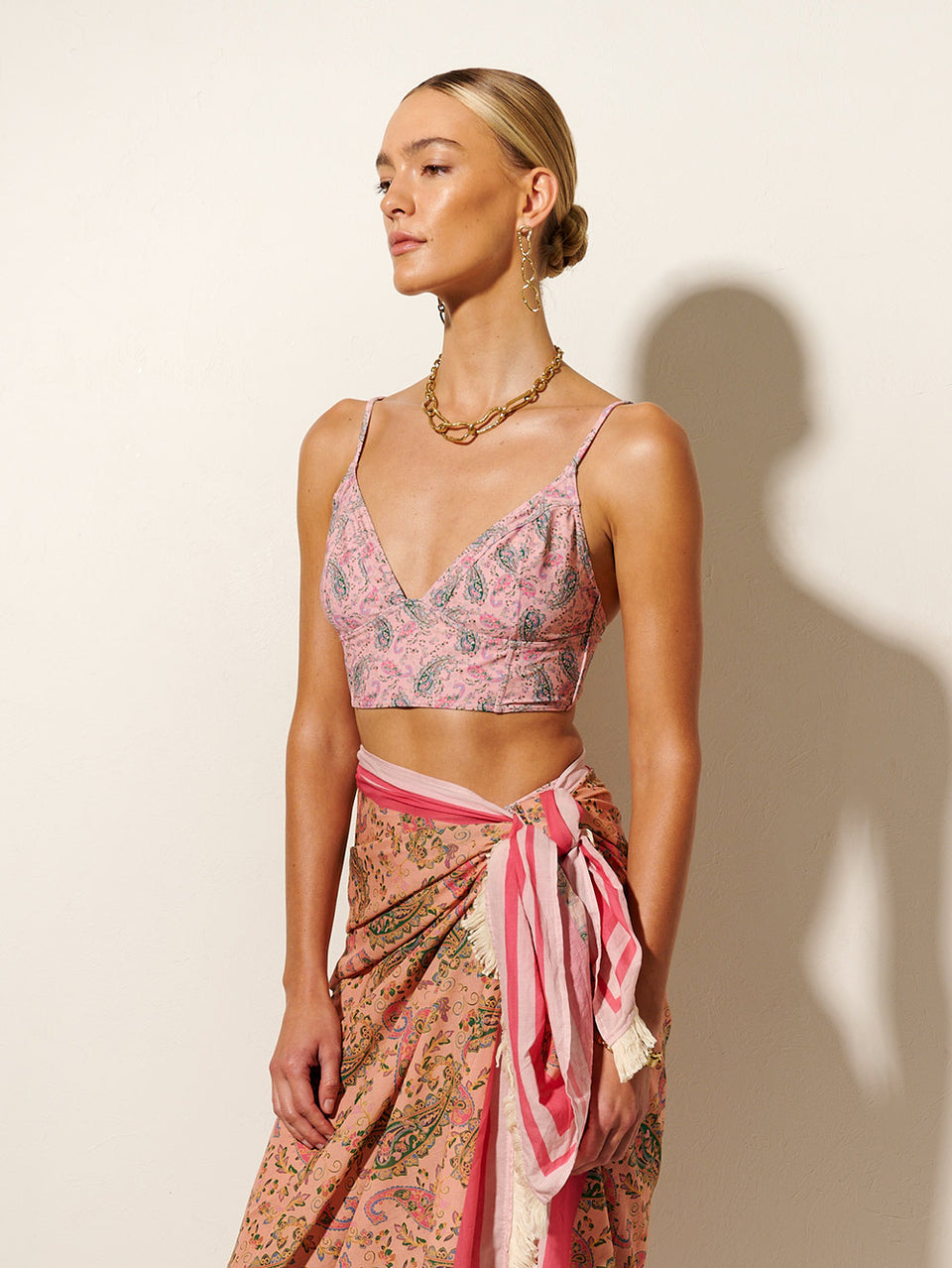 Isha Panelled Bikini Top KIVARI | Model wears pink paisley bikini top side view