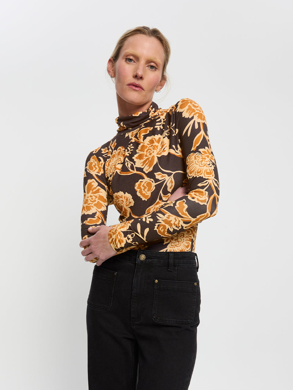 Kaia Skivvy KIVARI | Model wears black and orange floral skivvy