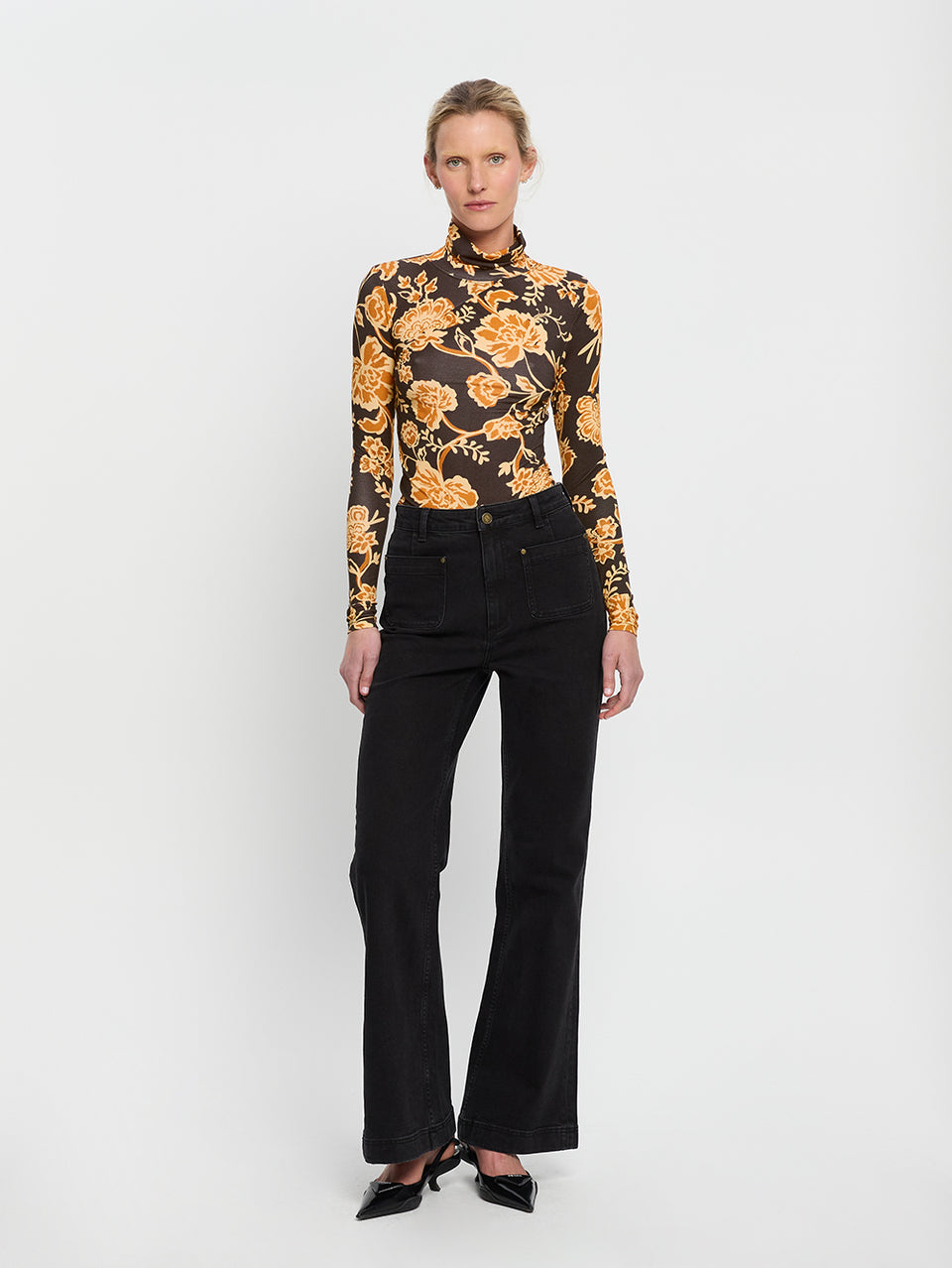 Kaia Skivvy KIVARI | Model wears black and orange floral skivvy