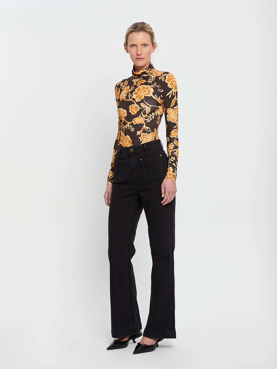 Kaia Skivvy KIVARI | Model wears black and orange floral skivvy side view