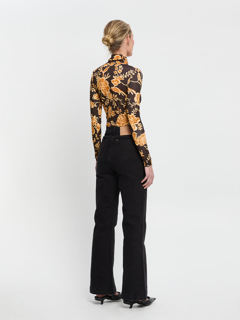Kaia Skivvy KIVARI | Model wears black and orange floral skivvy back view
