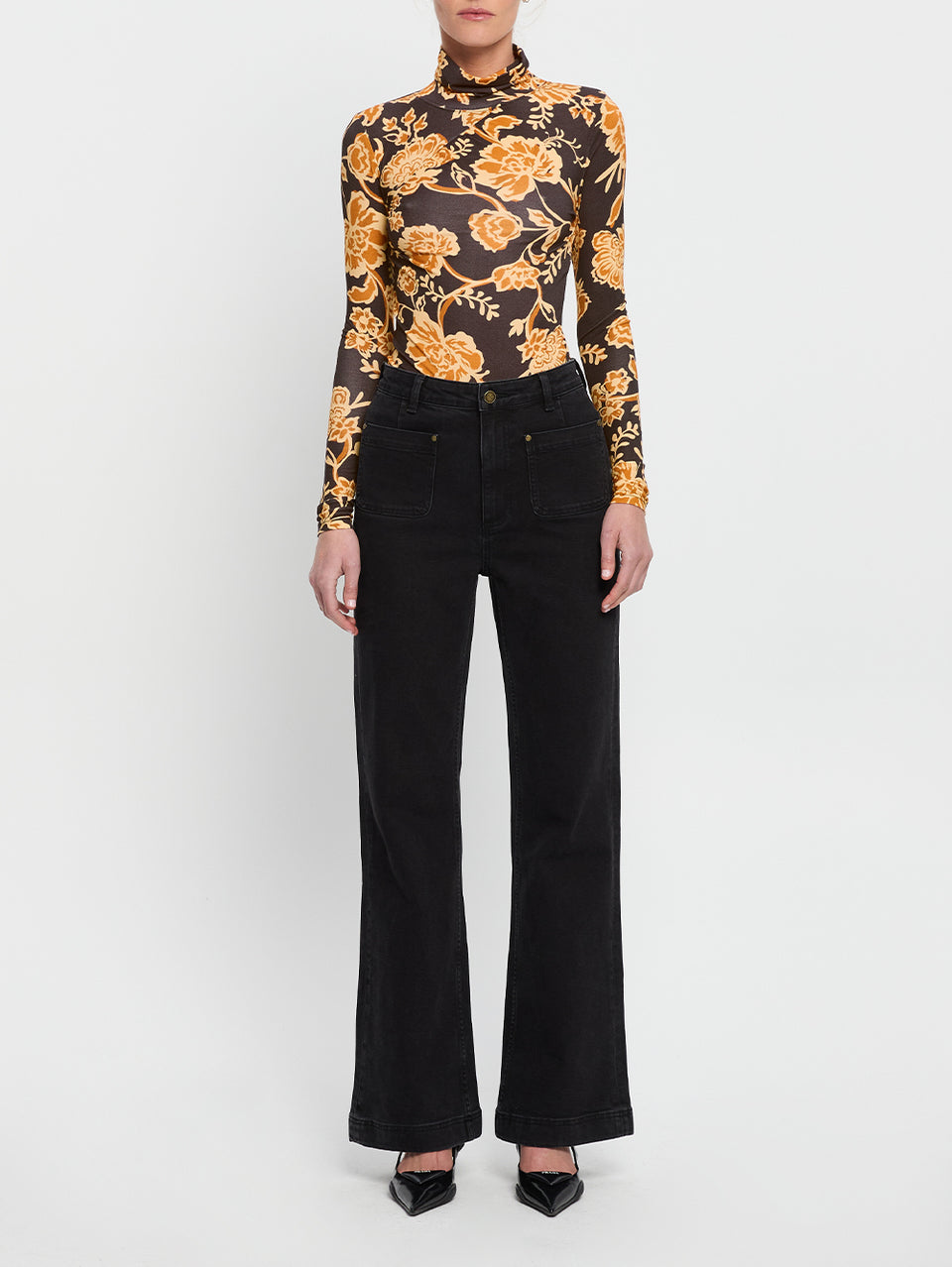 Kaia Skivvy KIVARI | Model wears black and orange floral skivvy