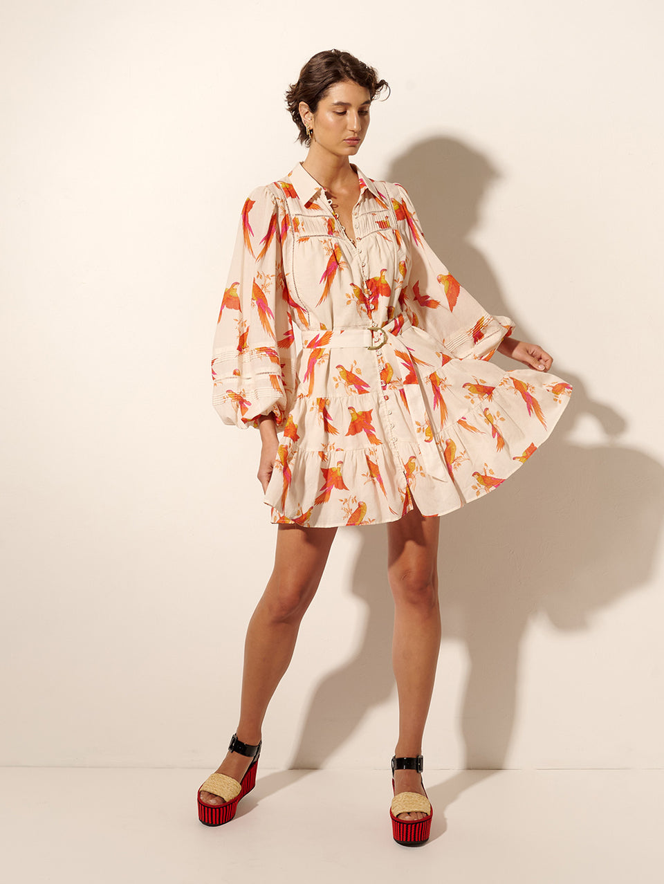 Kaylee Mini Dress KIVARI | Model wears pink and orange bird print mini dress