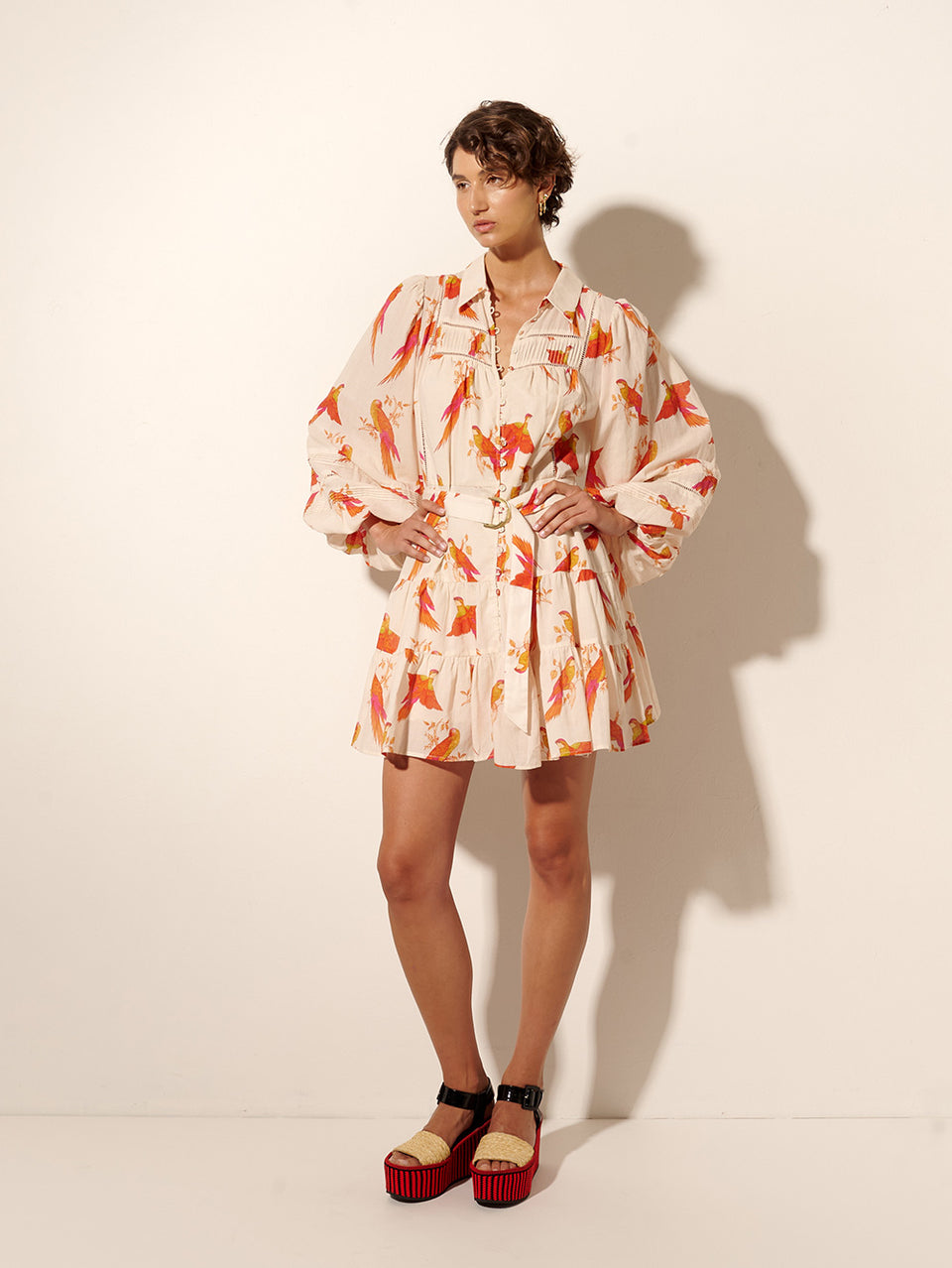 Kaylee Mini Dress KIVARI | Model wears pink and orange bird print mini dress