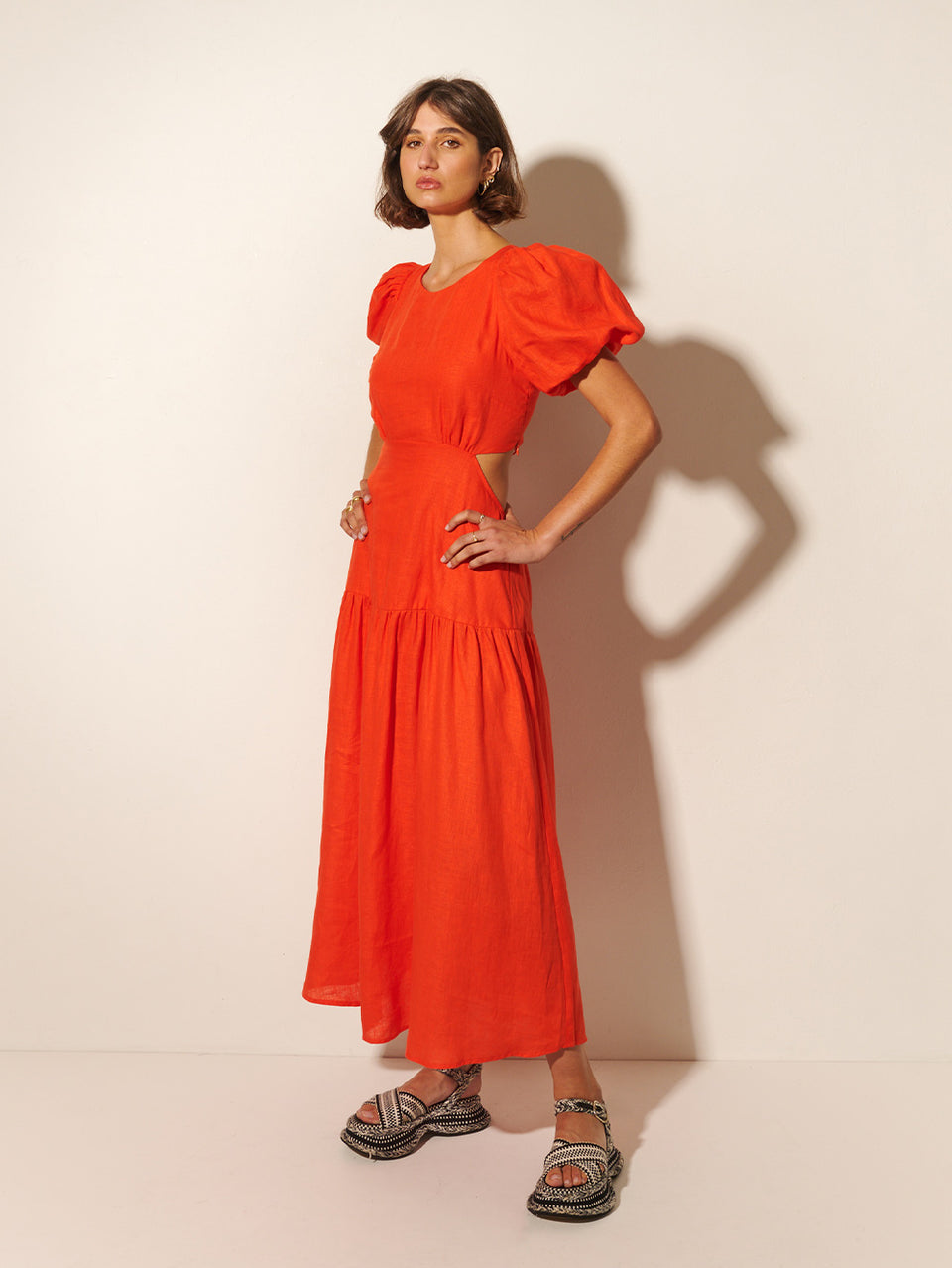 Kennedy Maxi Dress KIVARI | Model wears red maxi dress side view