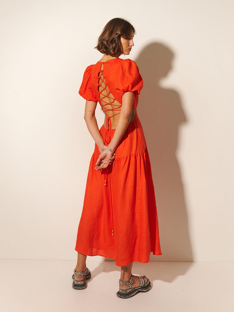 Kennedy Maxi Dress KIVARI | Model wears red maxi dress back view