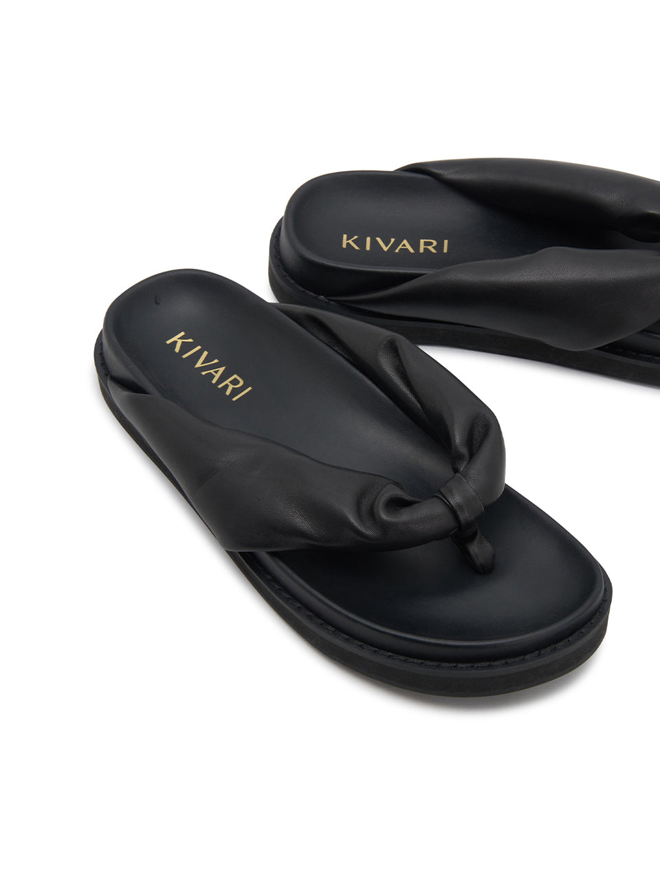 Black sandals with 'Kivari' branding on a white background