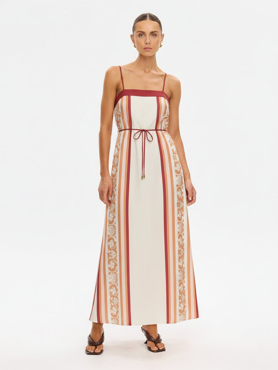 KIVARI Lilia Maxi Dress in cream stripe – full-length front view of women's linen maxi dress with floral lace side panel and tie waist