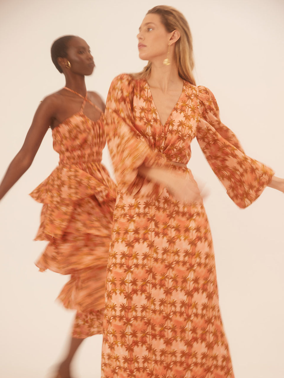 Leilani Cut Out Maxi Dress KIVARI | Model wears bronze and peach palm printed maxi dress campaign