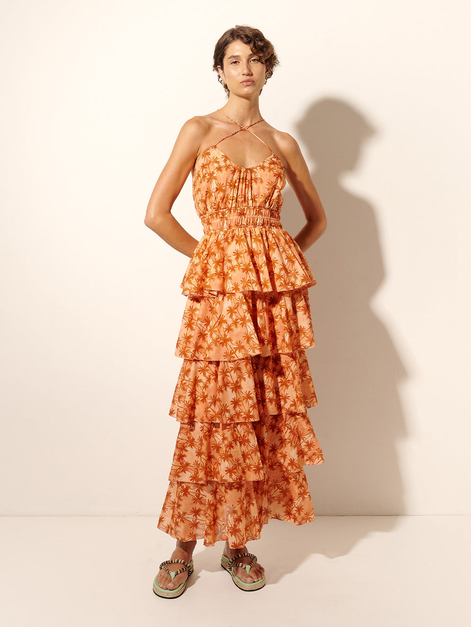Leilani Maxi Dress KIVARI | Model wears bronze and peach palm printed maxi dress 