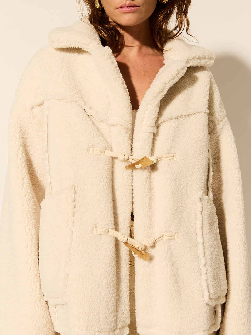 Lianna Jacket KIVARI | Model wears cream reversible jacket detail 