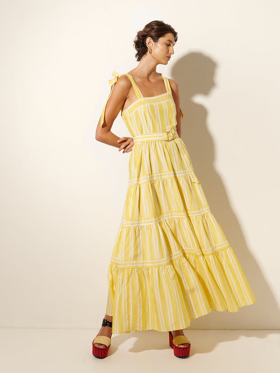Lola Maxi Dress KIVARI | Model wears yellow and white striped maxi dress