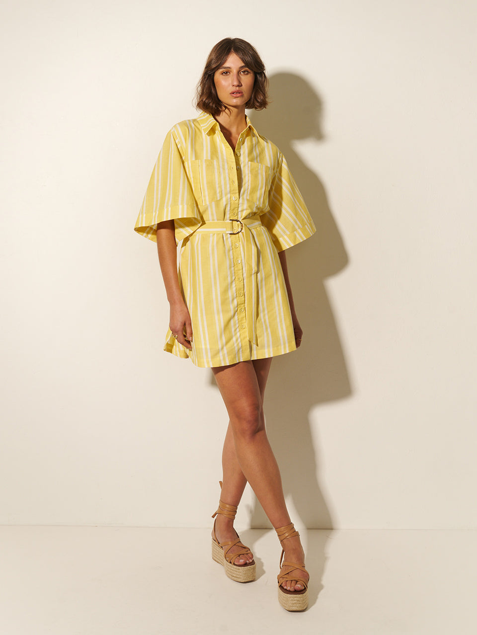 Lola Shirt Dress KIVARI | Model wears yellow and white striped shirt dress