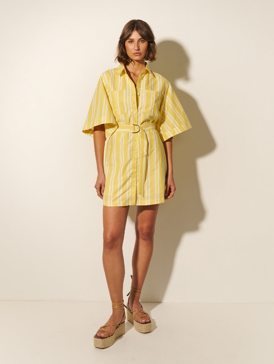 Lola Shirt Dress KIVARI | Model wears yellow and white striped shirt dress