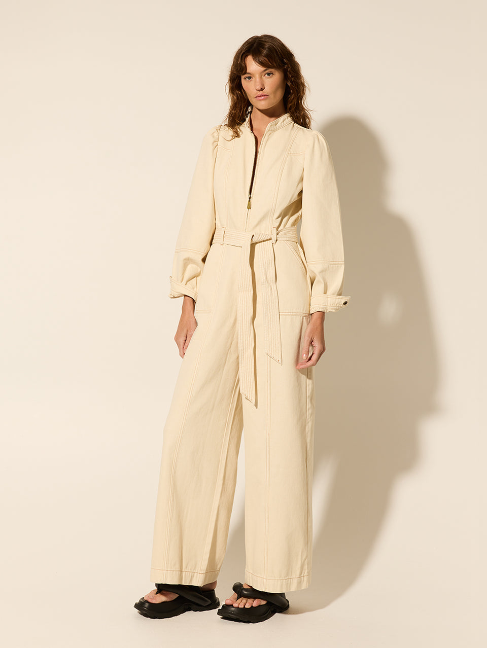 Lourdes Boilersuit Cream | Model wears cream boilersuit side view
