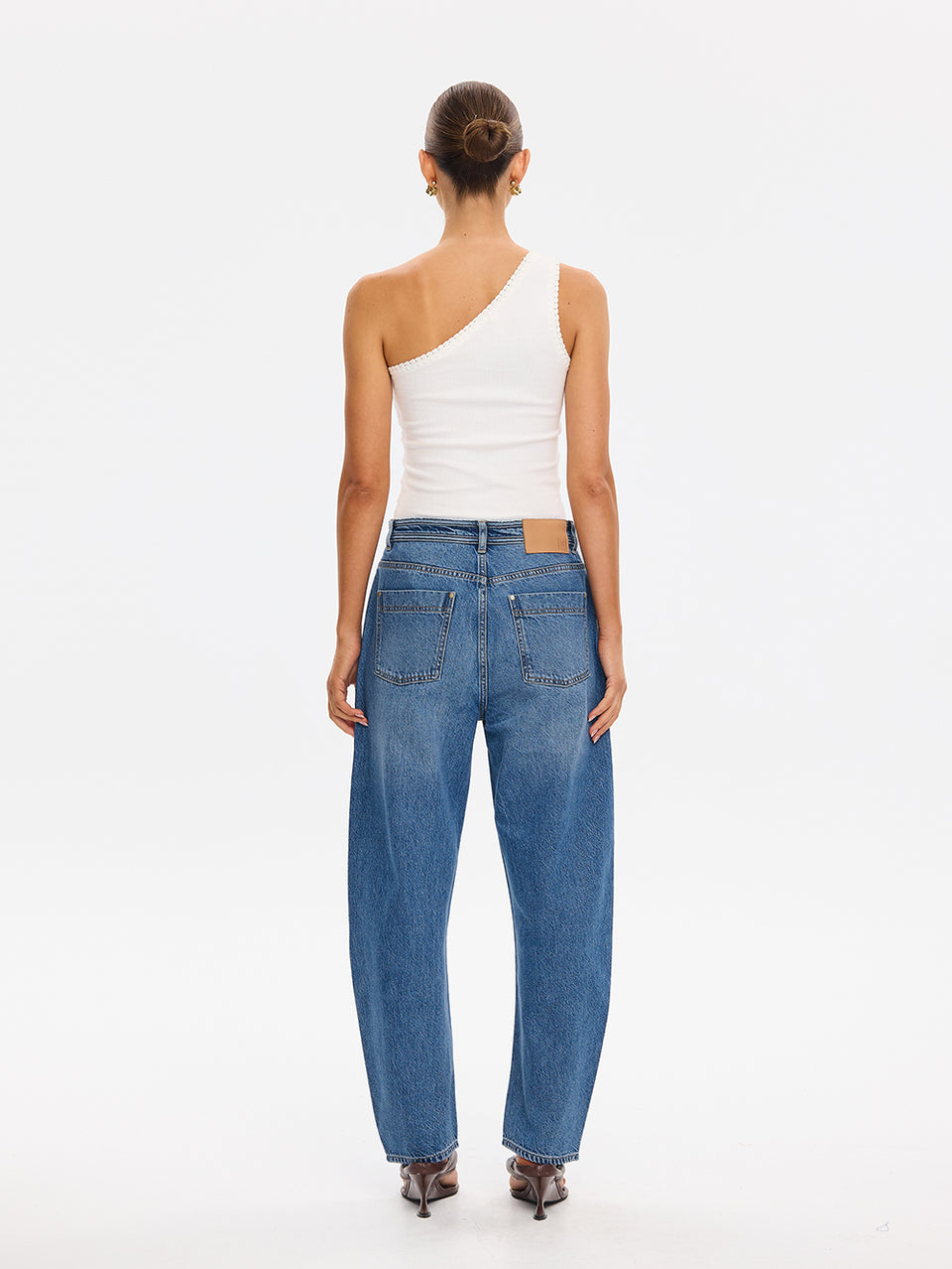 KIVARI Dylan Jeans in Drift Blue – back view styled with a white one-shoulder top