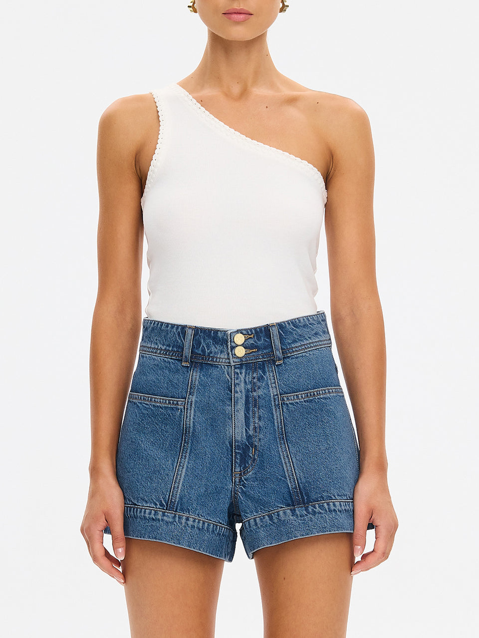 KIVARI Rita Denim Shorts in Drift Blue – high-waisted denim shorts styled with a white one-shoulder top
