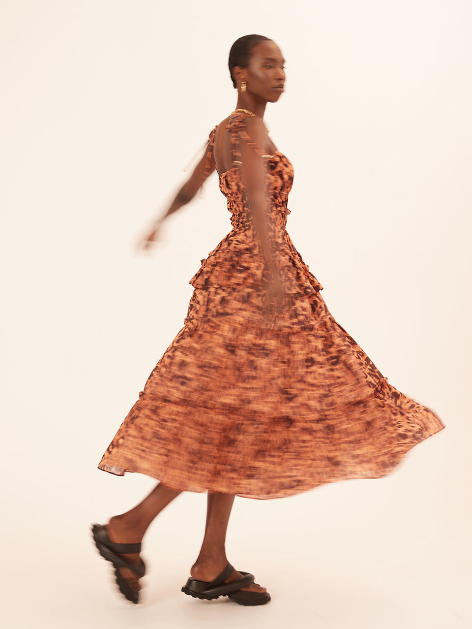 Madison Midi Dress KIVARI | Model wears orange and brown leopard midi dress campaign