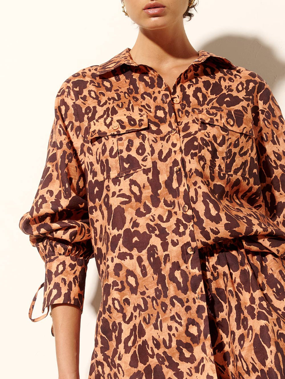 Madison Shirt KIVARI | Model wears orange and brown leopard shirt close up