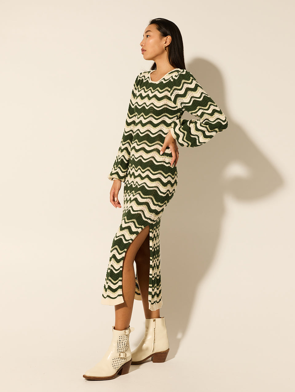 Marcella Knit Midi Dress KIVARI | Model wears green and cream knit midi dress side view