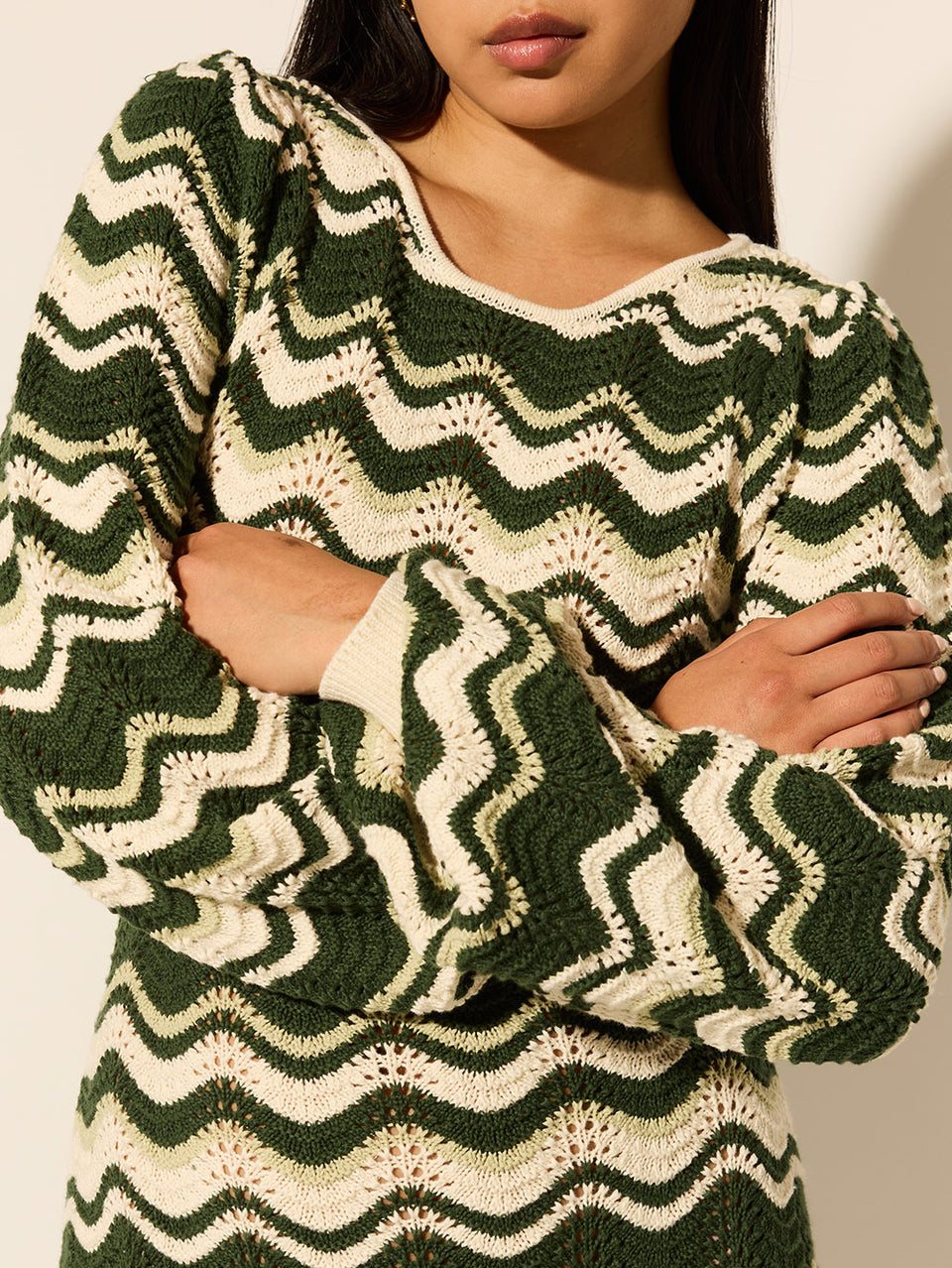 Marcella Knit Midi Dress KIVARI | Model wears green and cream knit midi dress close up