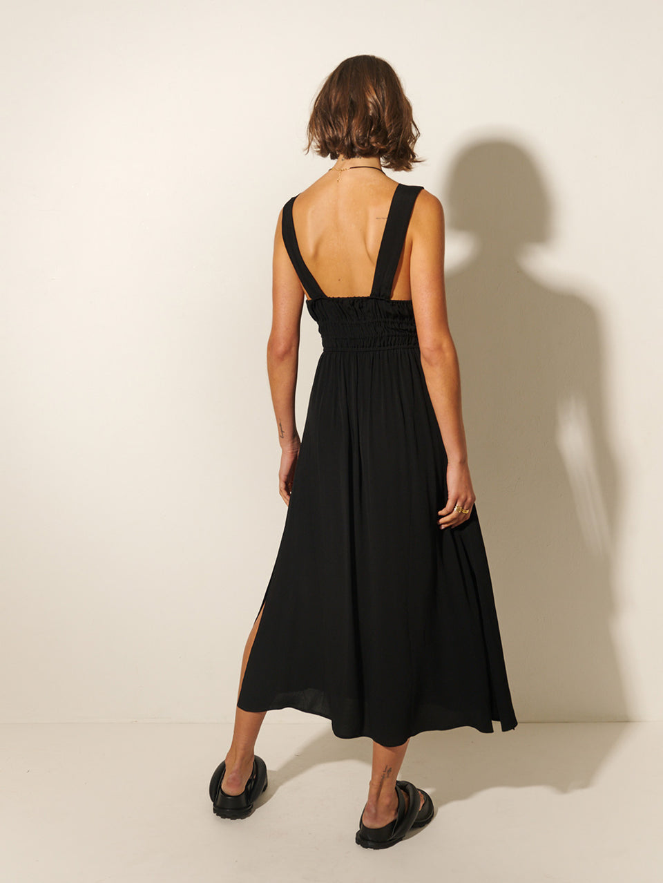Maria Strappy Midi Dress KIVARI | Model wears black midi dress back view