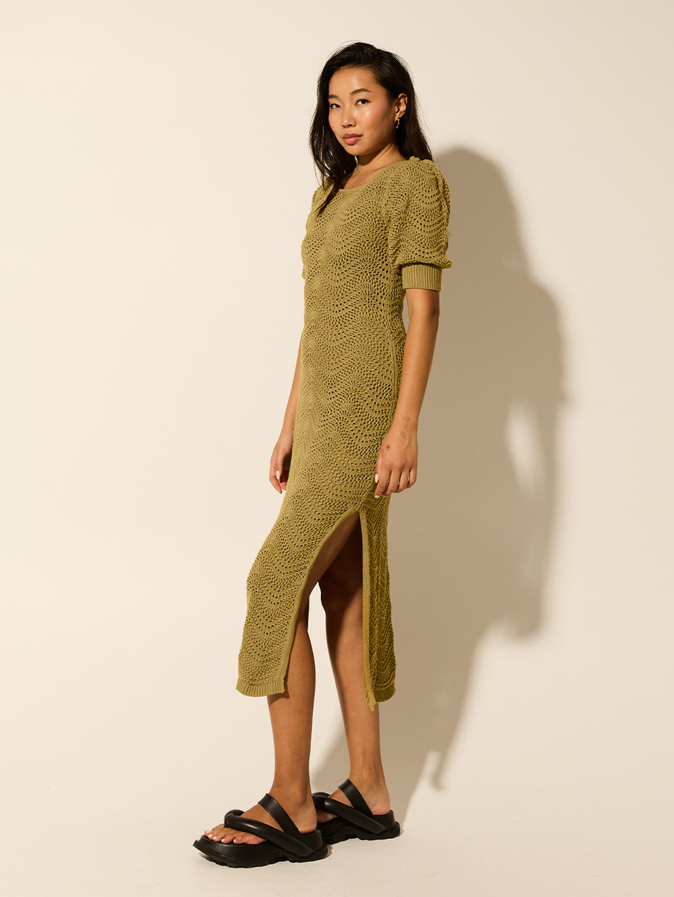 Mariana Knit Midi Dress Khaki KIVARI | Model wears khaki knit midi dress side view