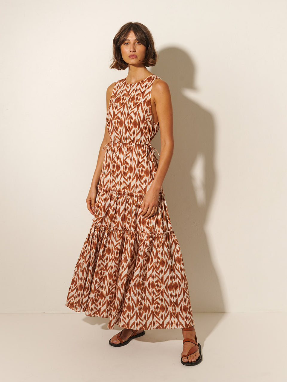 Marisa Cut Out Maxi Dress KIVARI | Model wears brown and ivory aztek printed cut out maxi dress side view