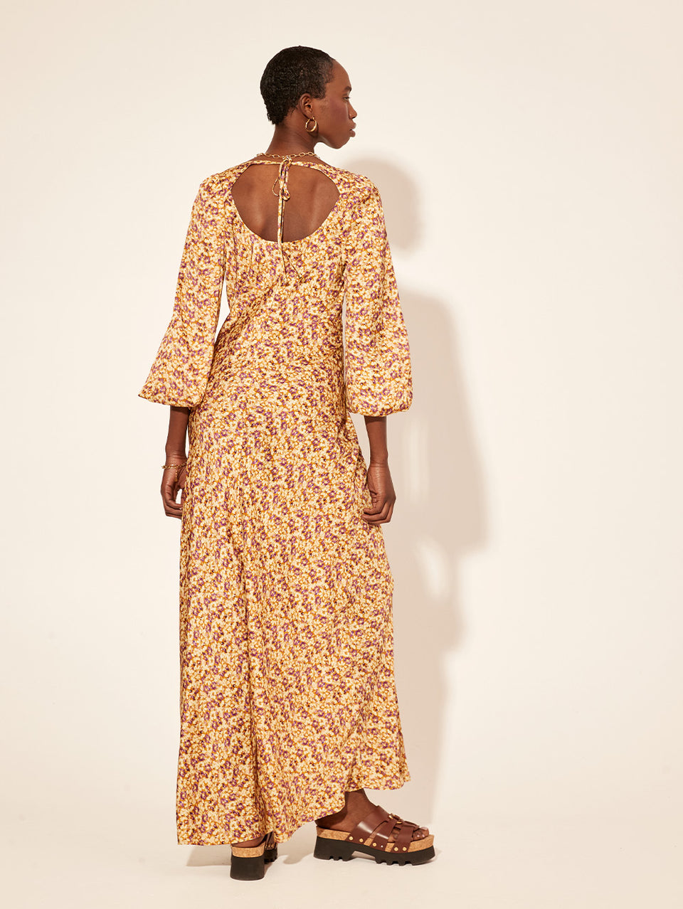 Mia Bias Cut Maxi Dress KIVARI | Model wears orange and purple ditsy printed maxi dress back view