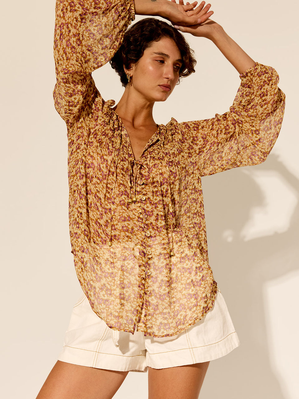 Mia Blouse KIVARI | Model wears orange and purple ditsy printed blouse vibe shot