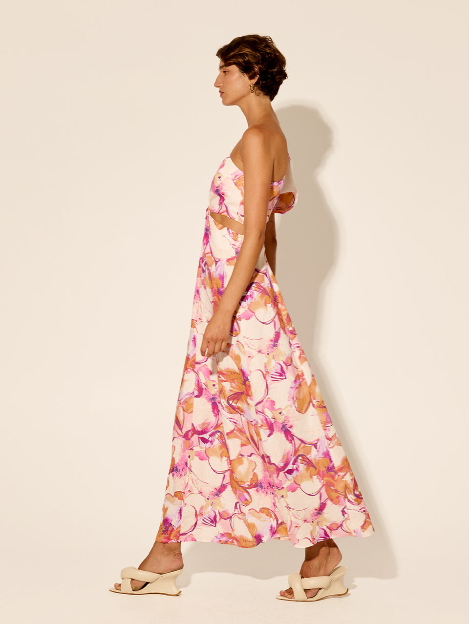 Nadia One Shoulder Midi Dress KIVARI | Model wears pink and orange watercolour floral midi dress side view