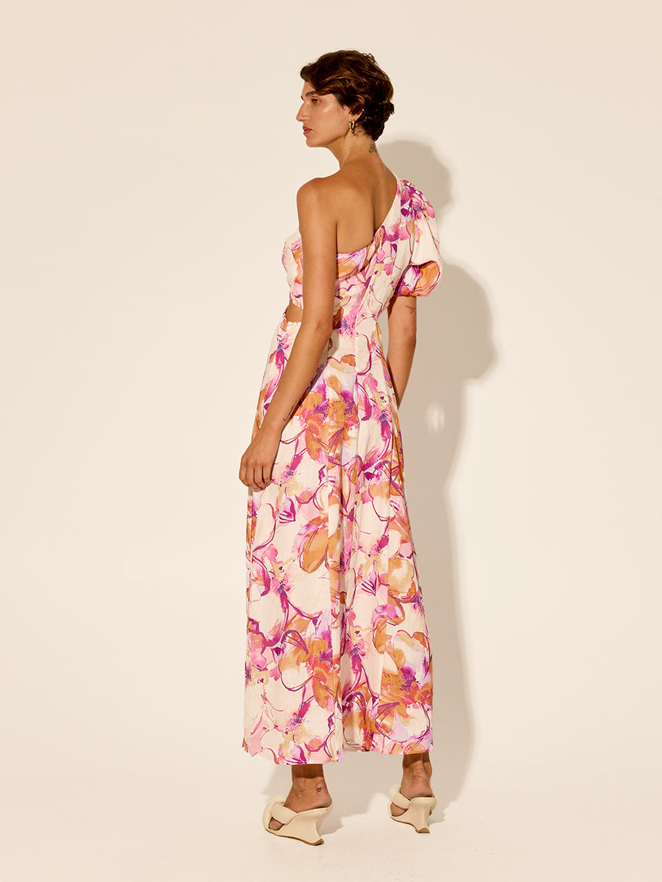 Nadia One Shoulder Midi Dress KIVARI | Model wears pink and orange watercolour floral midi dress back view