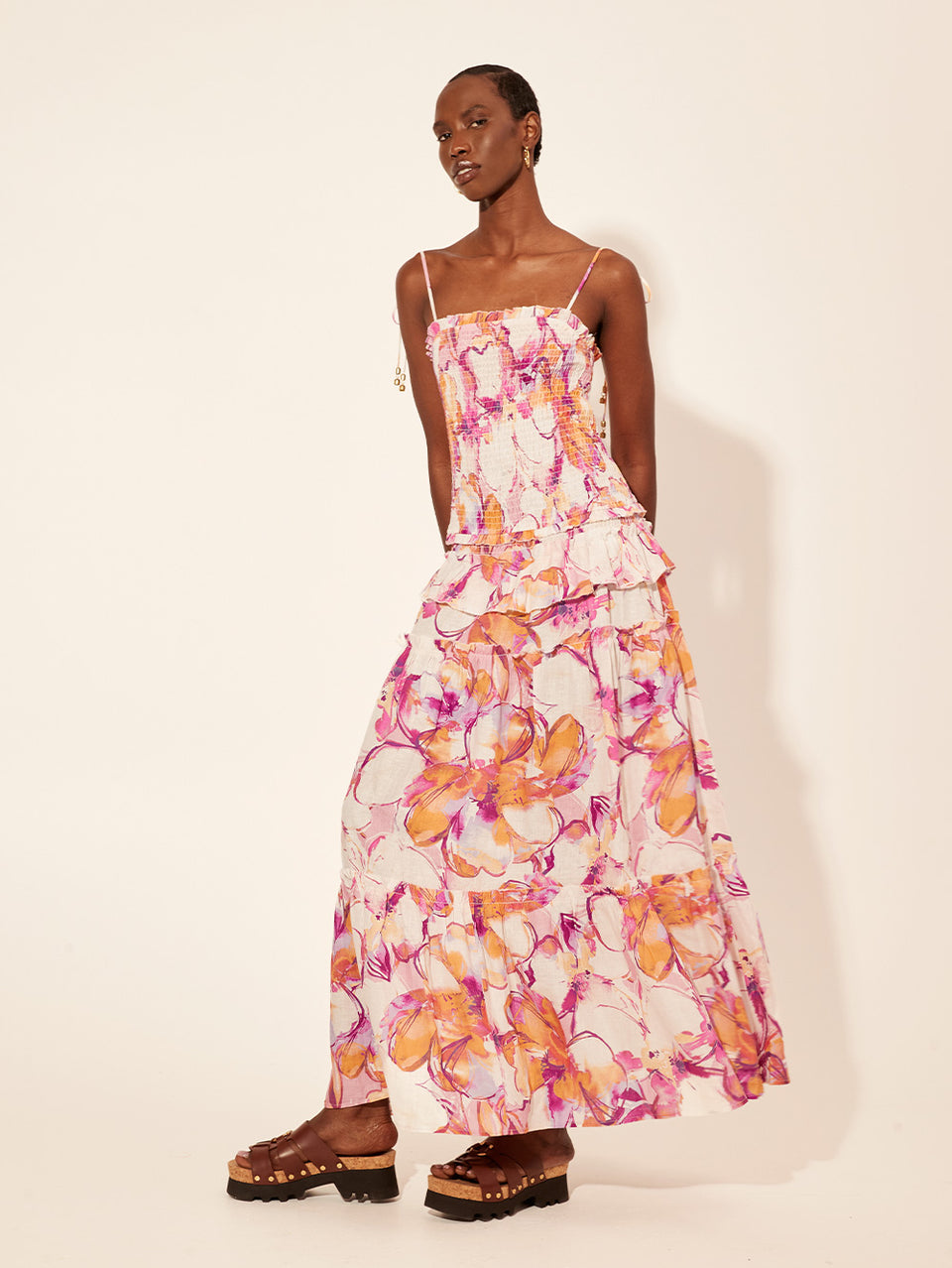 Nadia Strappy Maxi Dress KIVARI | Model wears pink and orange watercolour floral strappy maxi dress side view