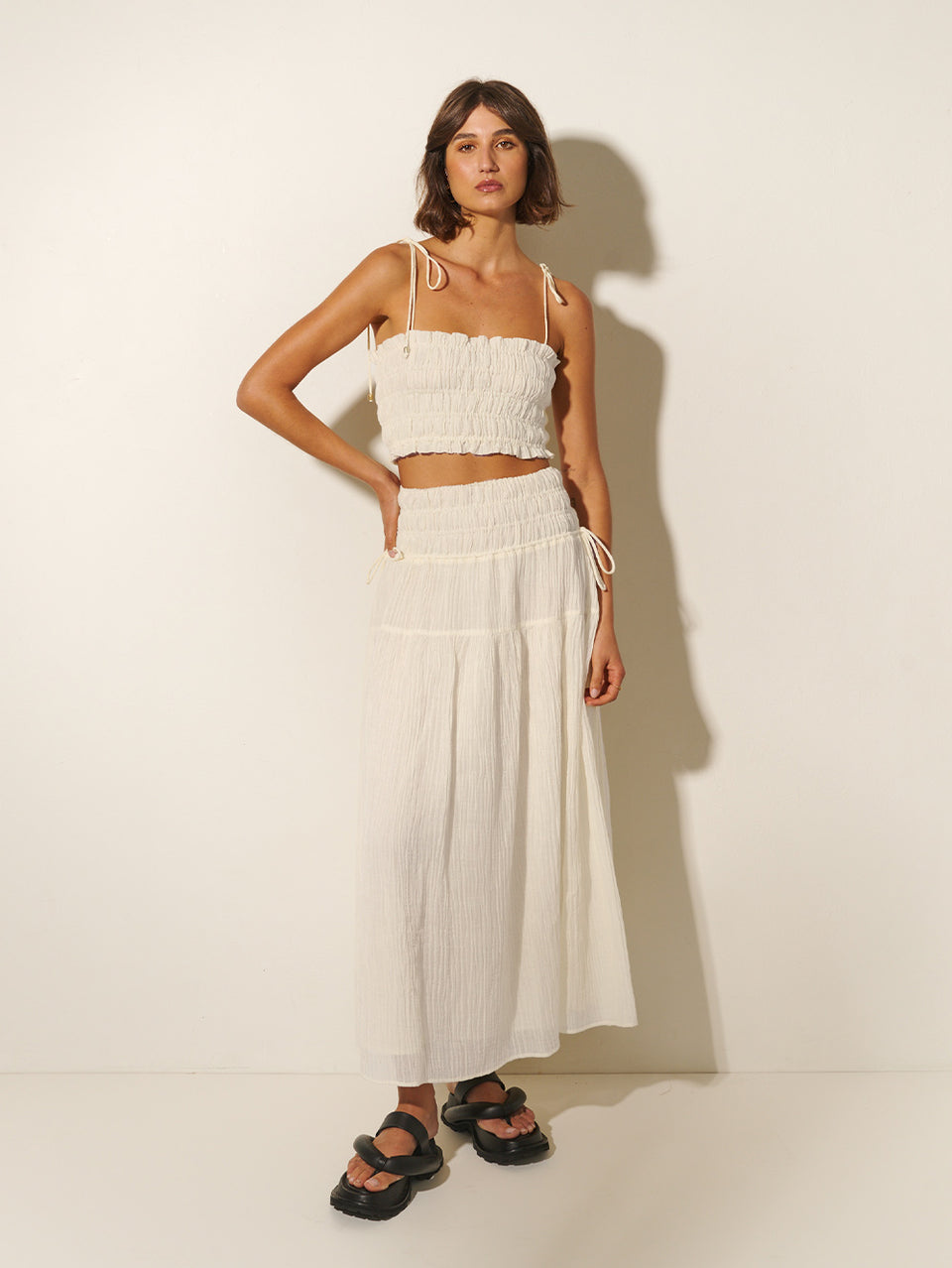 Nora Maxi Skirt KIVARI | Model wears ivory maxi skirt with matching crop top