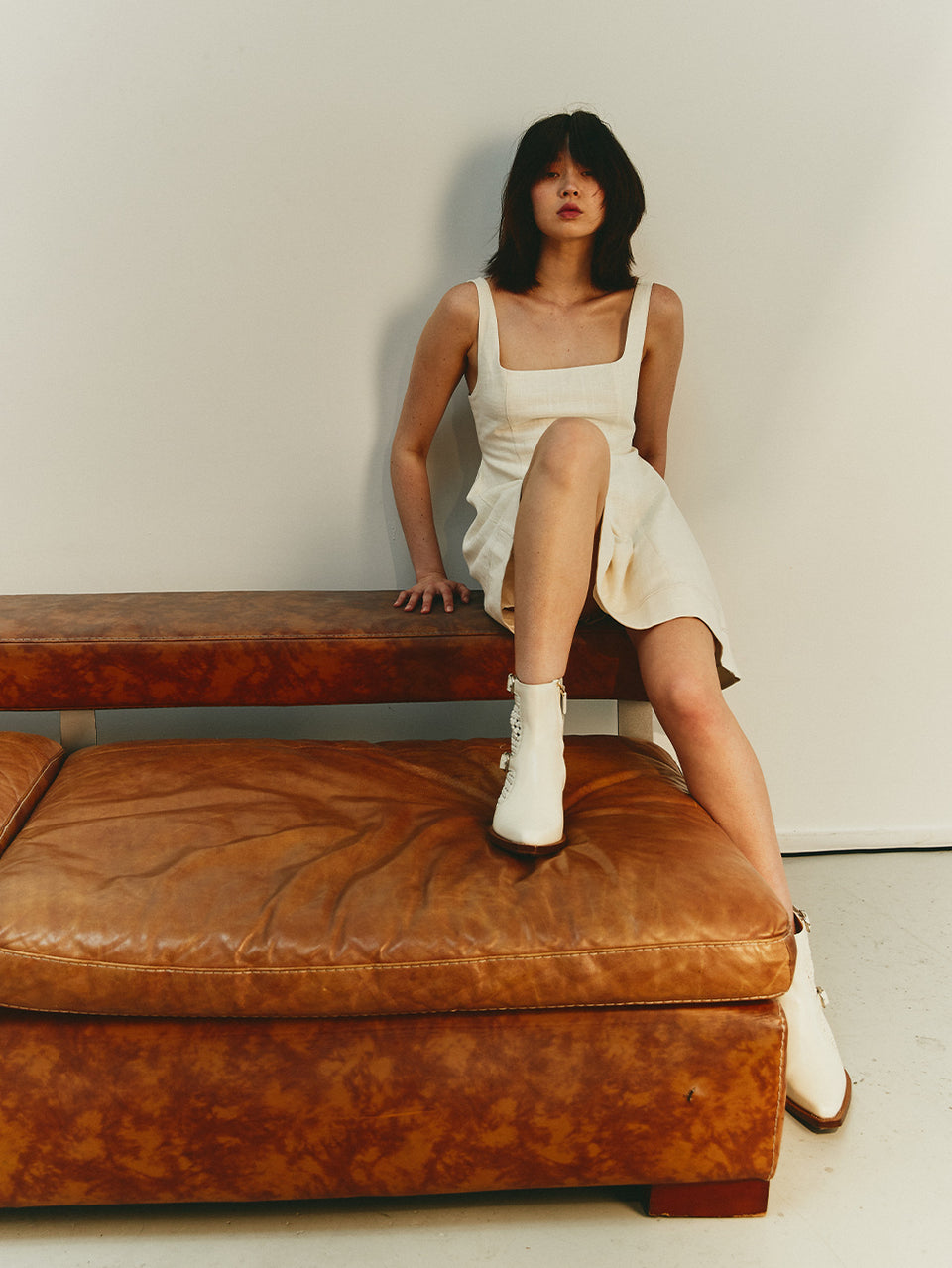 Oaklee Mini Dress Cream KIVARI | Model wears cream mini dress campaign