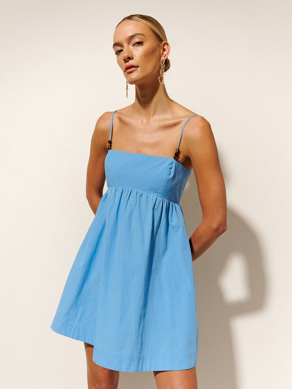 Oasis Mini Dress KIVARI | Model wears blue mini dress close up