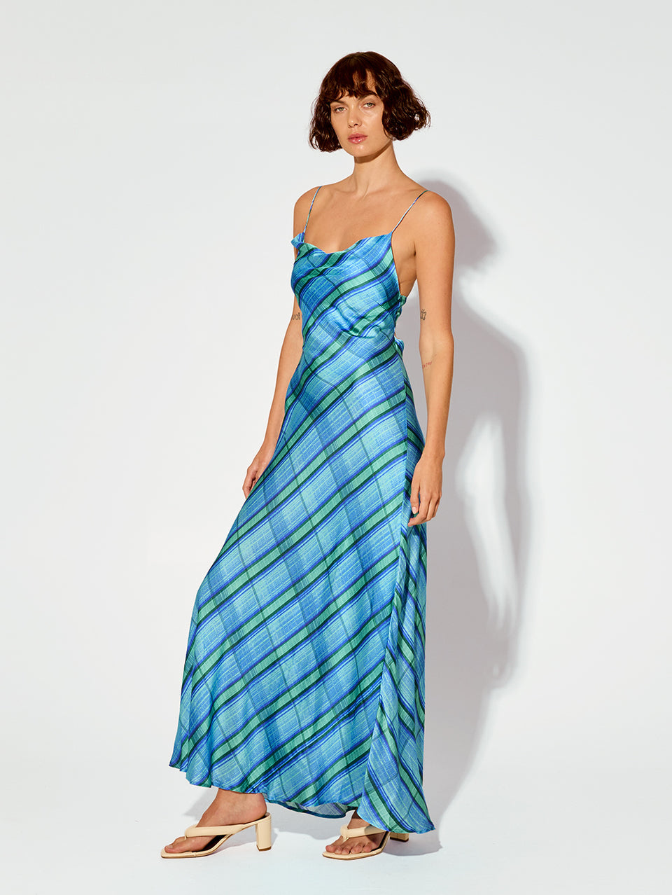 Oceana Slip Dress KIVARI | Model wears blue check print slip dress side view