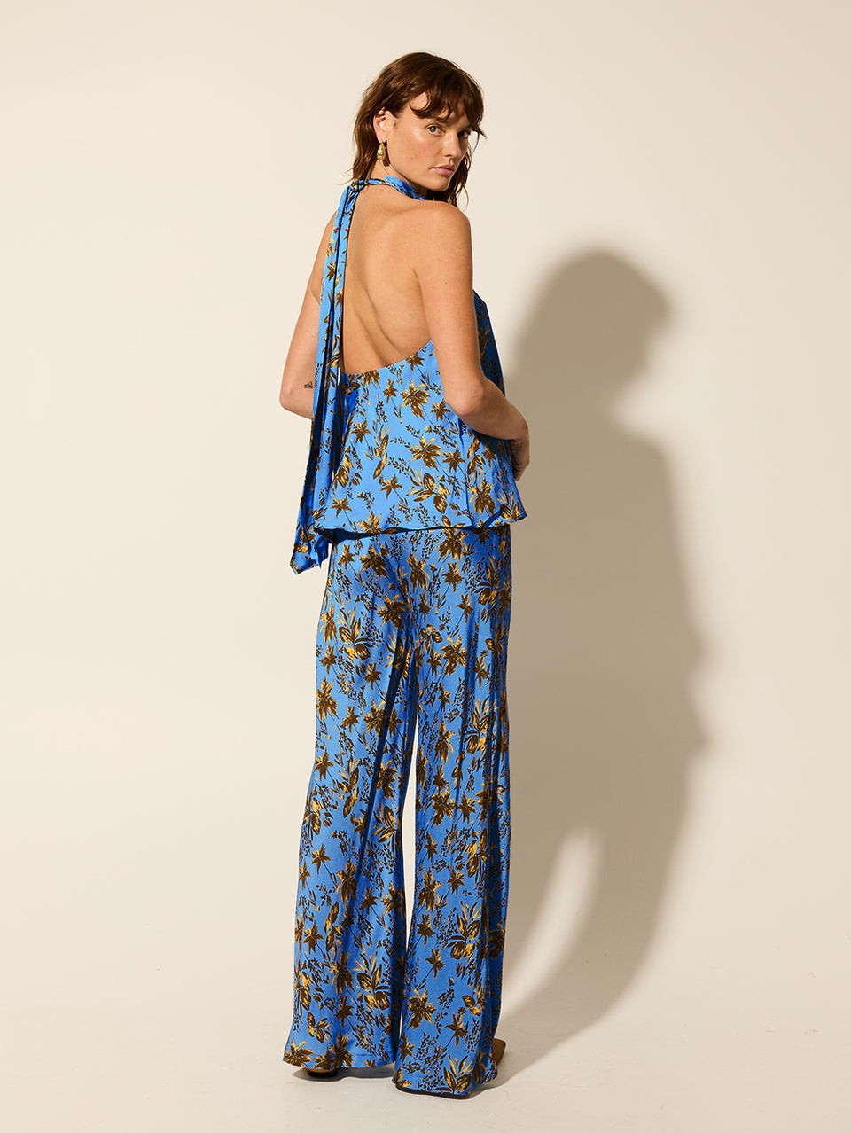 Paola Halter Top KIVARI | Model wears blue halter top back view
