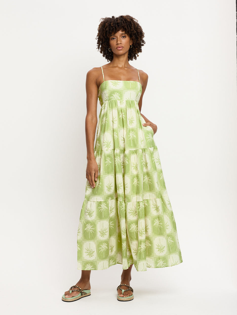 Paradiso Maxi Dress KIVARI | Model wears palm tree printed maxi dress