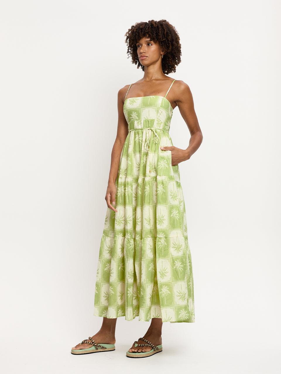 Paradiso Maxi Dress KIVARI | Model wears palm tree printed maxi dress side view