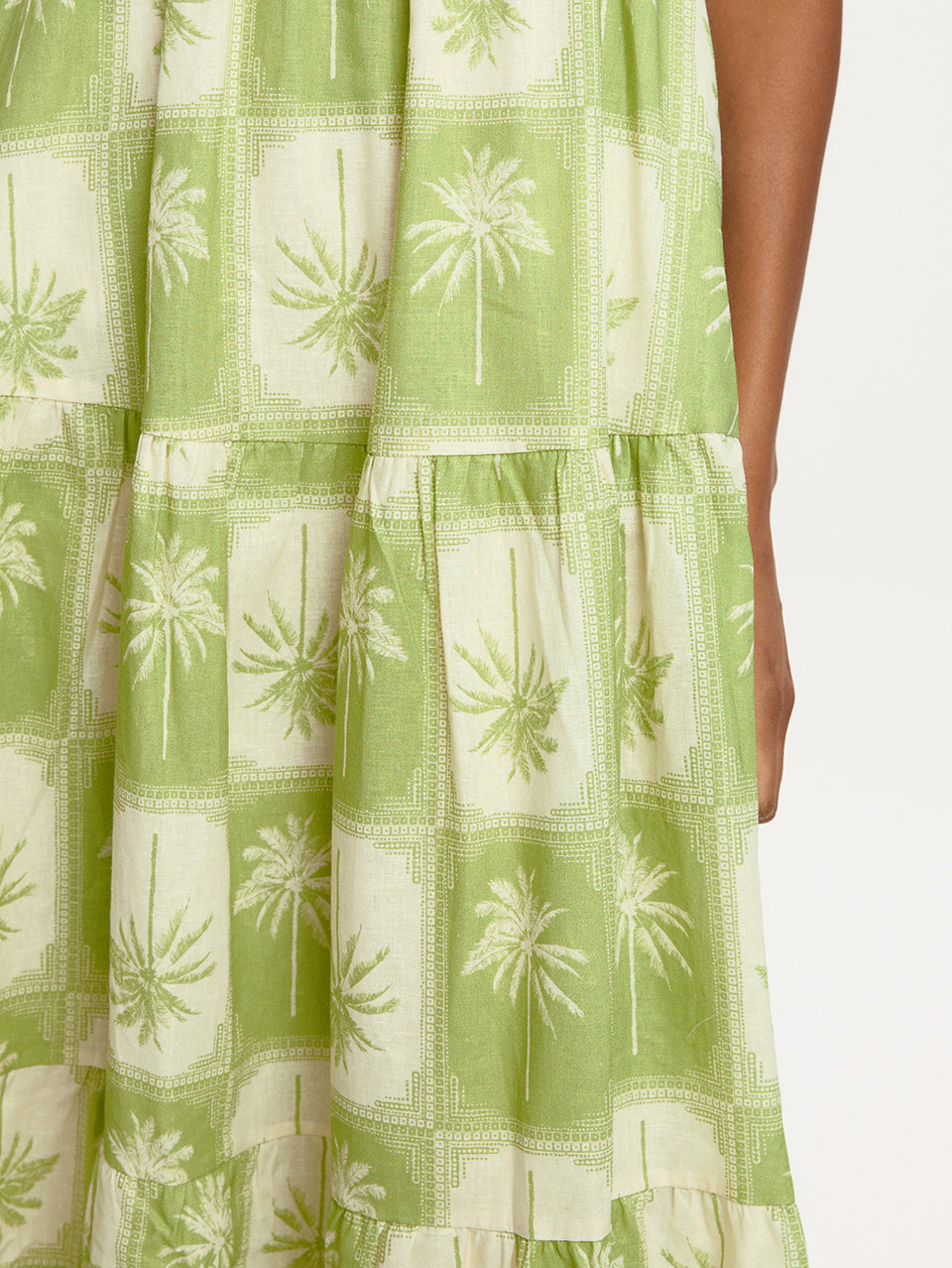 Paradiso Maxi Dress KIVARI | Model wears palm tree printed maxi dress detail shot
