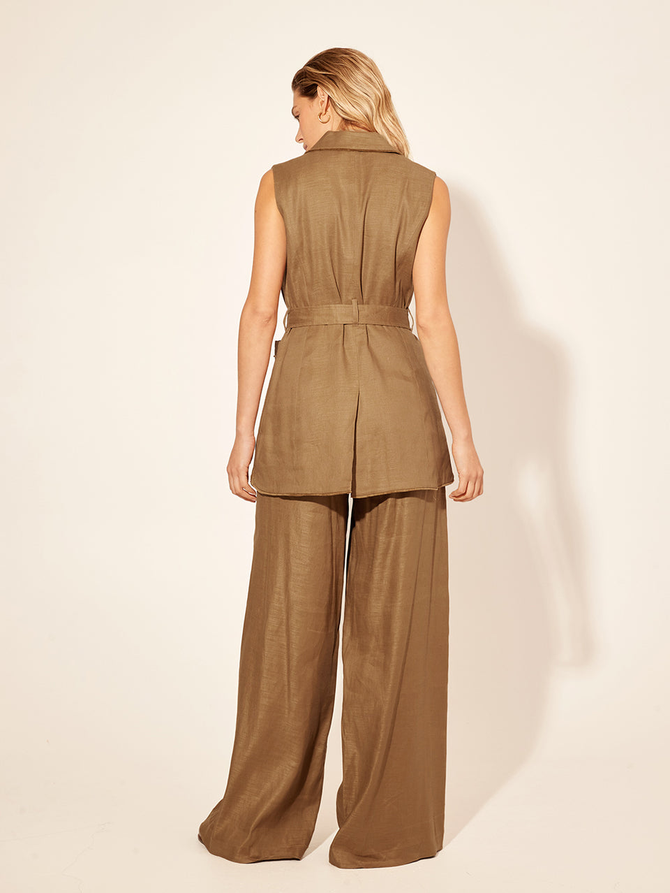 Penelope Pant KIVARI | Model wears brown tailored pant back view